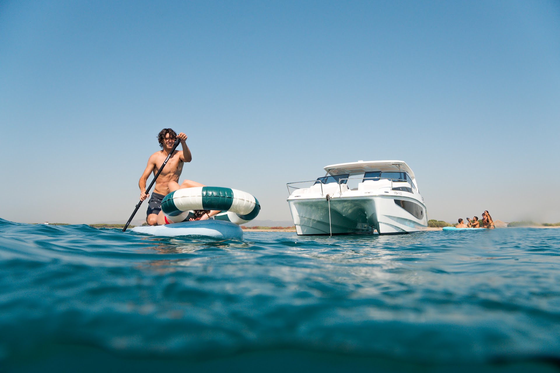Paddle surf next to the Aquila 36